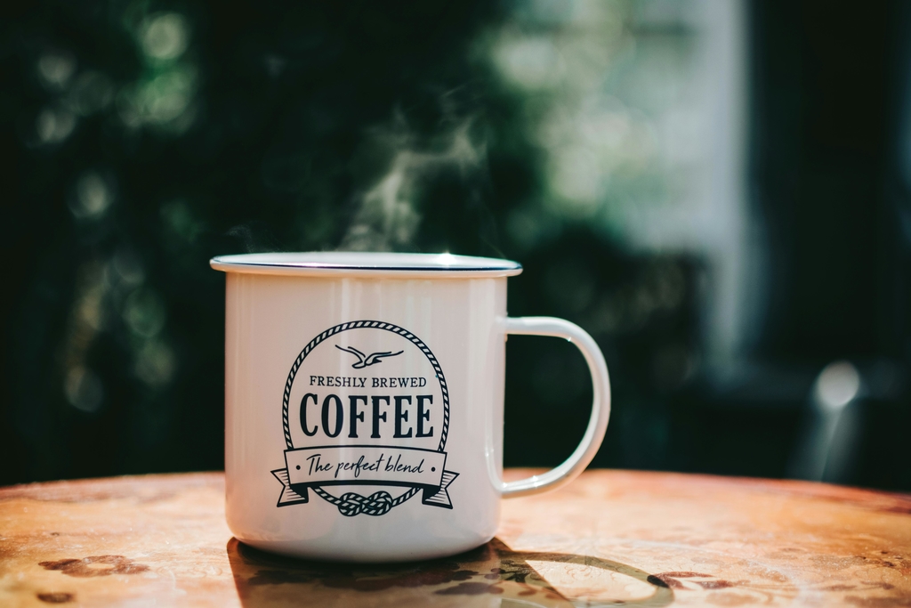 pexels-photo-1207918-1207918 Warm coffee mug steaming on a rustic table, evoking cozy morning vibes.