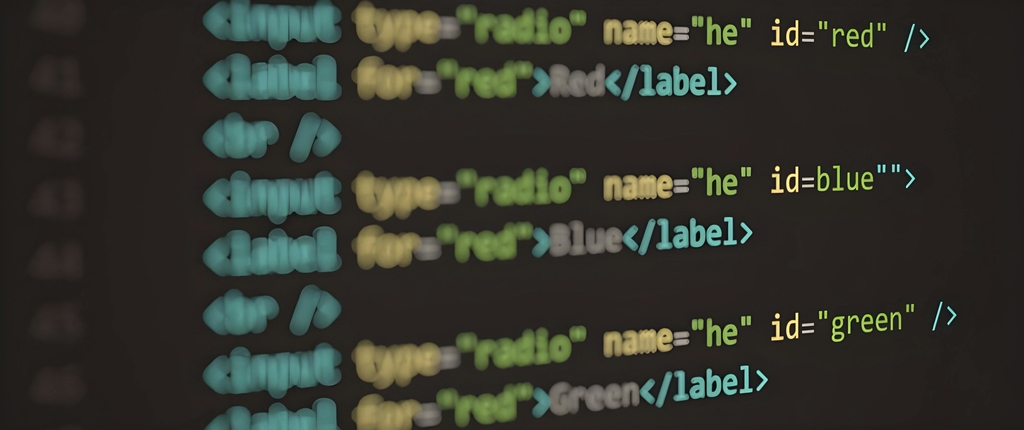 Ukázka HTML syntaxe na monitoru – responzivní webdesign